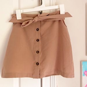 Beige button up skirt with tie bow in front